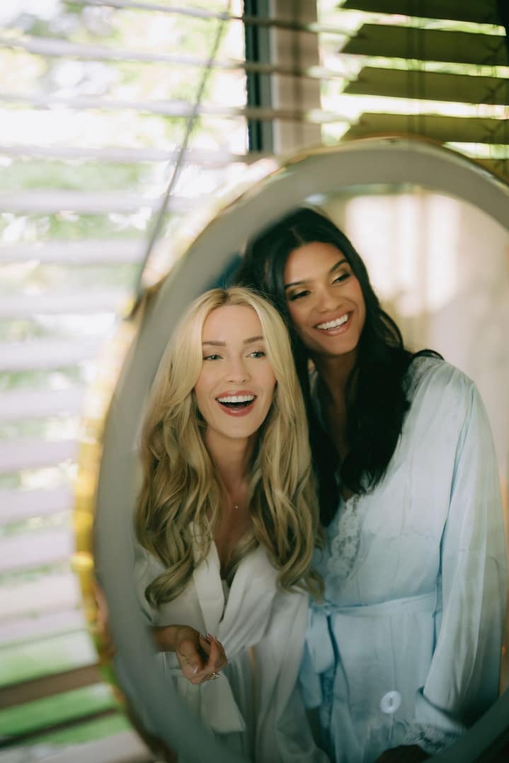 Cassie Randolph getting ready in the mirror before her Costa Rica wedding in Tamarindo