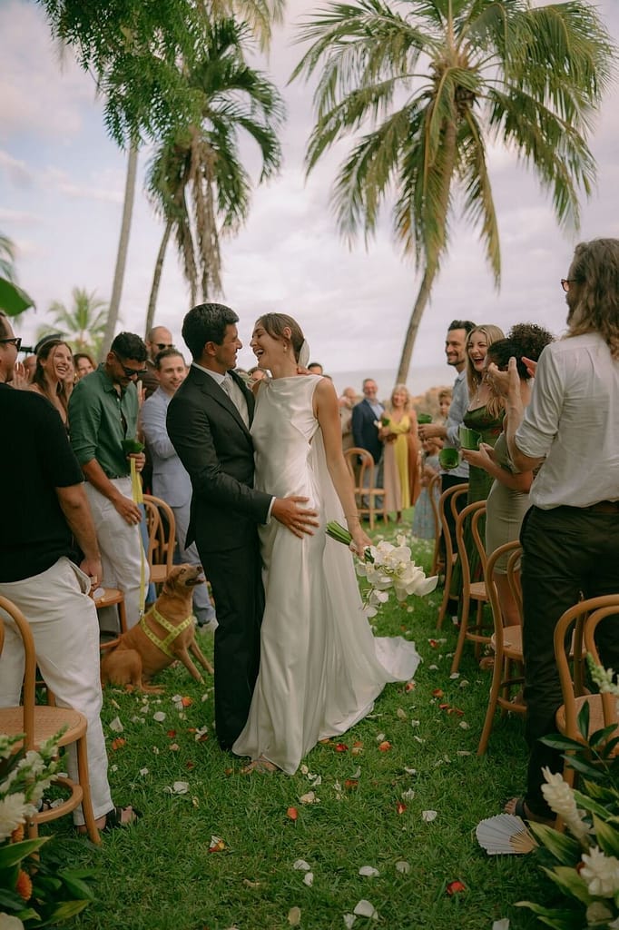 Bride and groom surrounded by guests after their wedding ceremony near Montezuma, Costa Rica